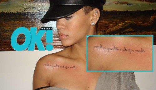  always a lesson” tattooed backwards near her right shoulder.