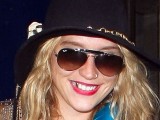 Kesha with a gold tooth
